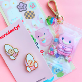 Limited Edition Sunset Starlit x Sharodactyl Smiling Kitty Keychain Collab